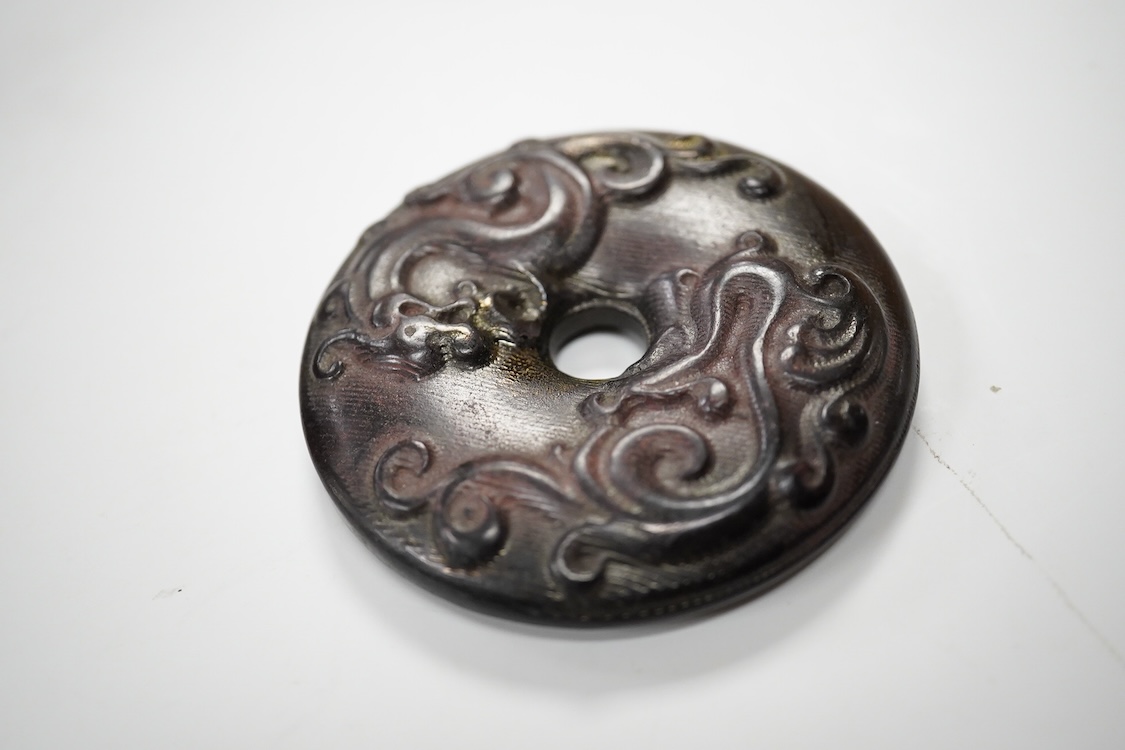 A Chinese pottery jug, two hardstone discs and a metal seal. Jug 17.5cm high